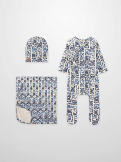 Blue Landmark layette set for boys by Adee; hat, blanket, and footed sleeper in blue toile print.