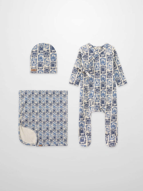 Blue Landmark layette set for boys by Adee; hat, blanket, and footed sleeper in blue toile print.