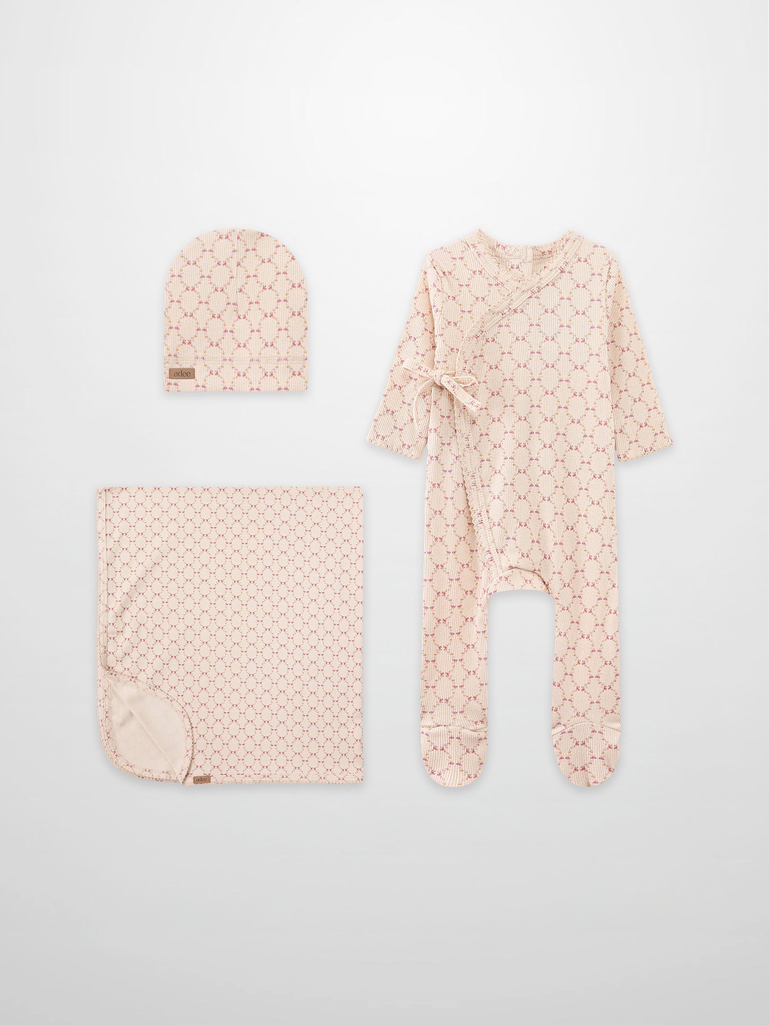 Floral Garland Layette Set by Adee; pink floral print hat, swaddle blanket, and footed sleepsuit