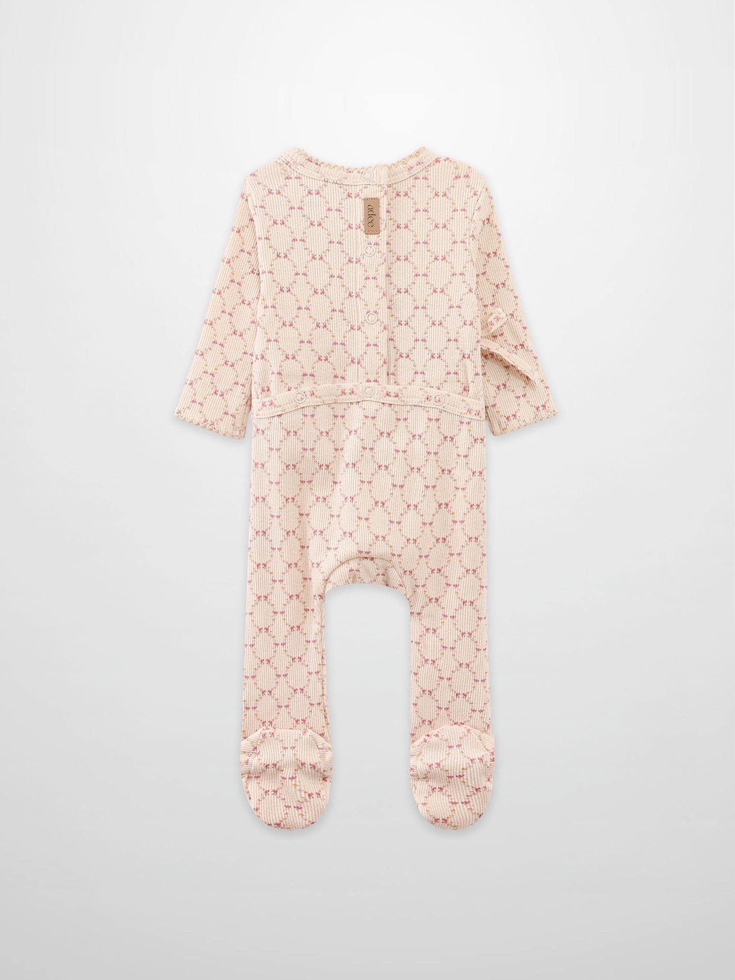 Floral Garland Stretchy girls romper by Adee in pink-beige knit with small floral pattern