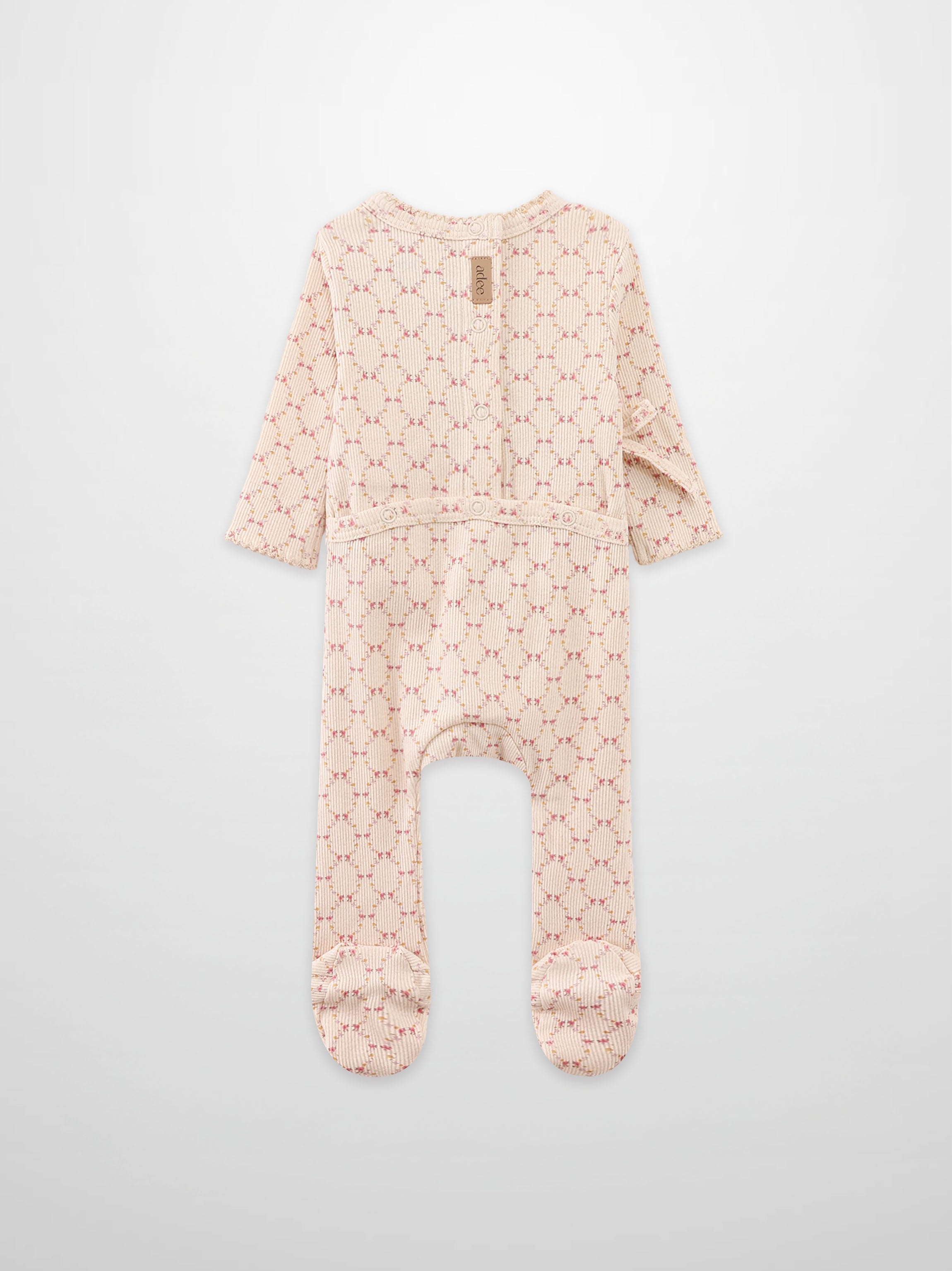 Floral Garland Stretchy girls romper by Adee in pink-beige knit with small floral pattern