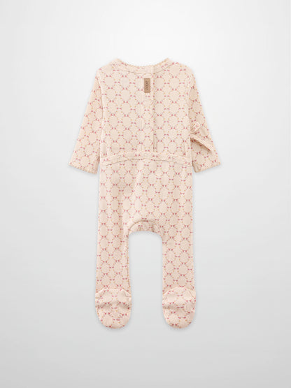 Floral Garland Stretchy girls romper by Adee in pink-beige knit with small floral pattern