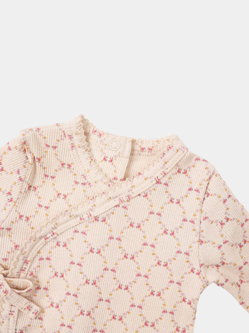 Adee Floral Garland layette set; pale pink ribbed knit with tiny pink and yellow flowers and ruffled edges.