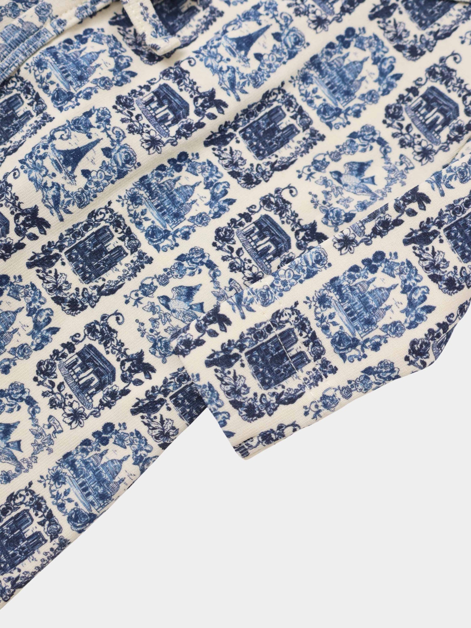 Blue Landmark Stretchy for boys by Adee; blue toile pattern on cream fabric.