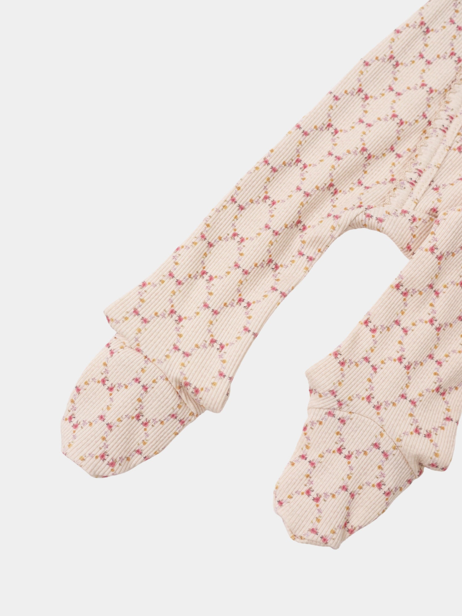 Adee Floral Garland Stretchy girls’ knit top with beige ribbed fabric and pink floral pattern.
