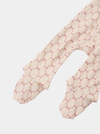 Adee Floral Garland Stretchy girls’ knit top with beige ribbed fabric and pink floral pattern.