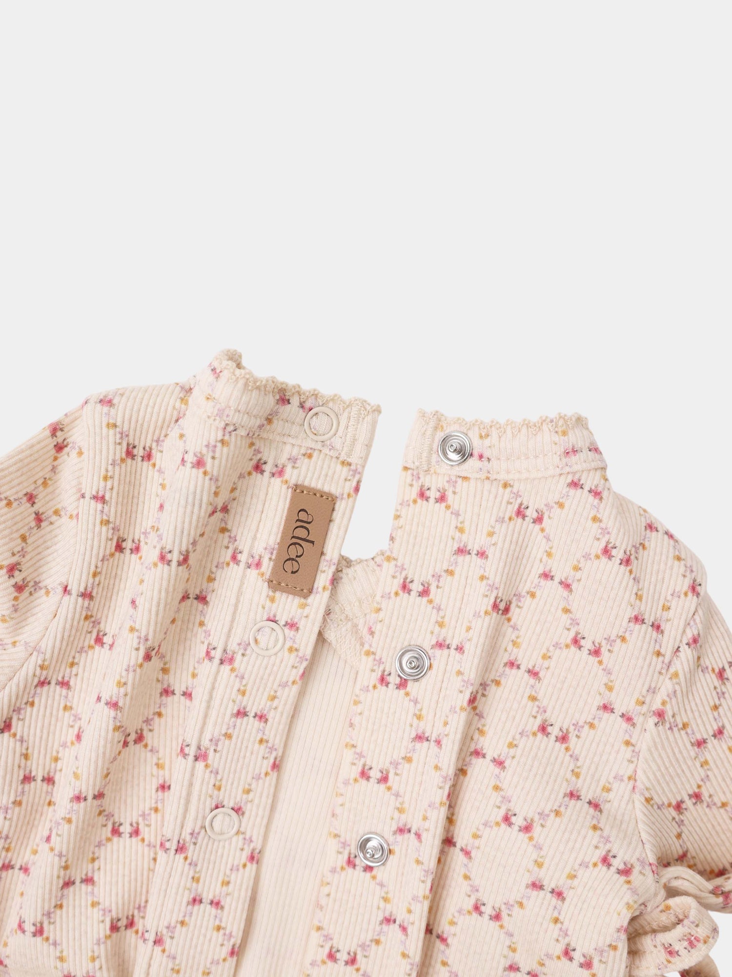 Floral Garland Stretchy girls stretchies by Adee; cream ribbed fabric with pink and yellow flowers, front snap buttons