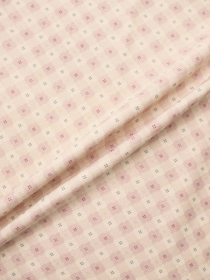 Little Button Stretchy Pink by Adee, pink knit fabric for girls with tiny pink and teal dot motifs.