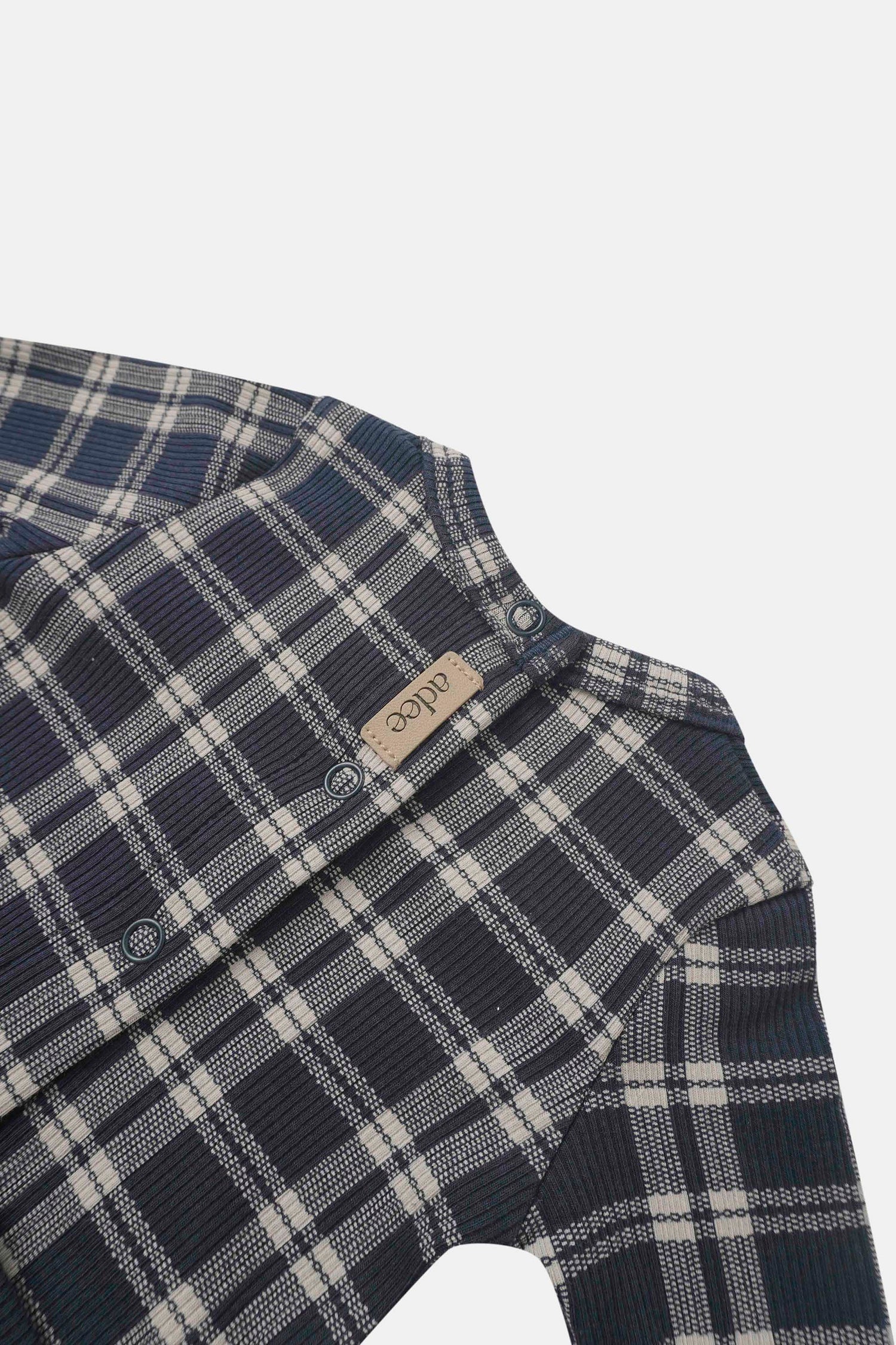 Navy plaid layette set for boys by Adee with snap closures.