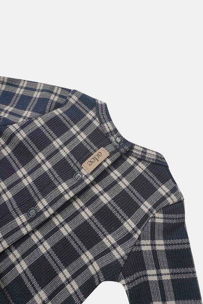 Navy plaid layette set for boys by Adee with snap closures.