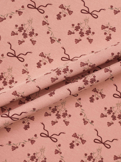 Bow Bouquet Stretchy girls stretchies fabric in pink with burgundy bows and tiny floral clusters.