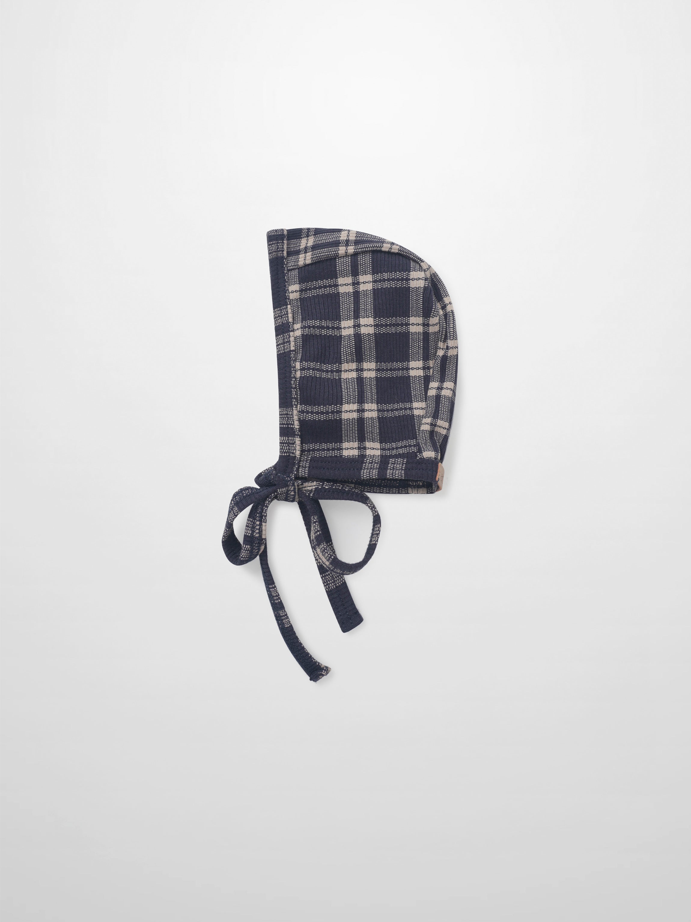 Navy plaid bonnet for boys by Adee with tie strings, apparel accessory.