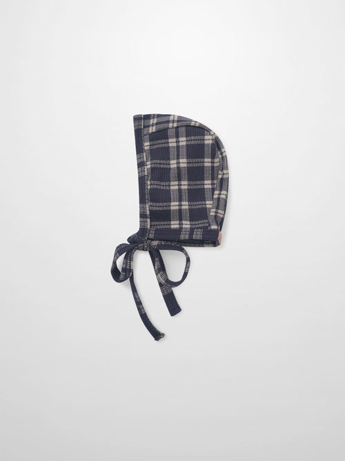 Navy plaid bonnet for boys by Adee with tie strings, apparel accessory.