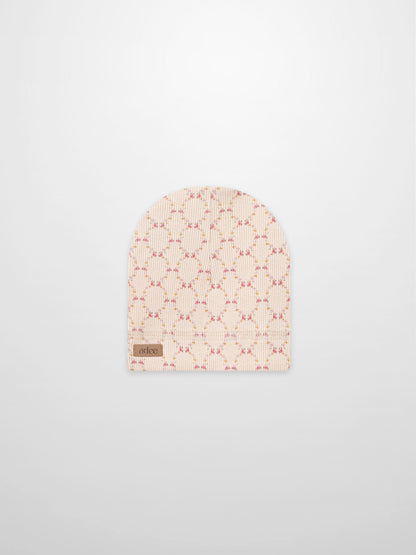 Floral Garland Hat for girls by Adee, pink rib-knit beanie with a delicate floral garland pattern and brand label.