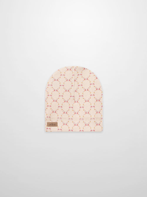 Floral Garland Hat for girls by Adee, pink rib-knit beanie with a delicate floral garland pattern and brand label.
