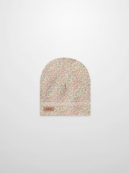 Pastel Petal Hat, floral-patterned girls hat by Adee featuring a visible brand patch
