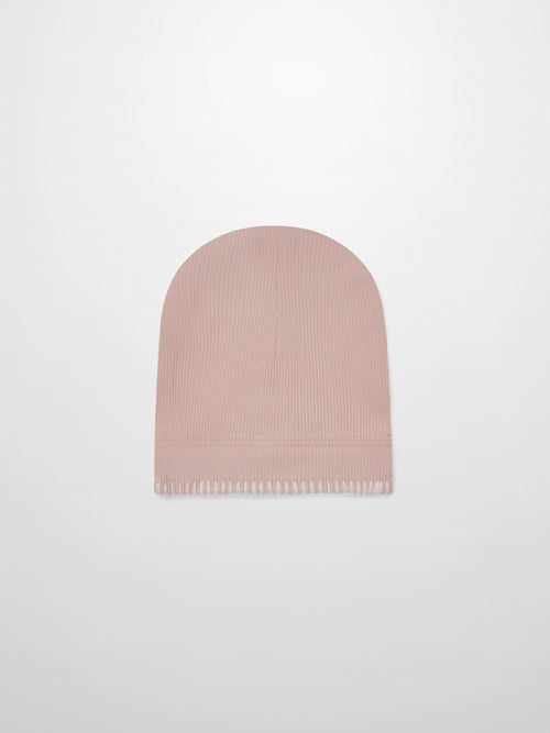 Legacy Stitch Hat by Adee, light pink ribbed knit girls beanie with fringed hem