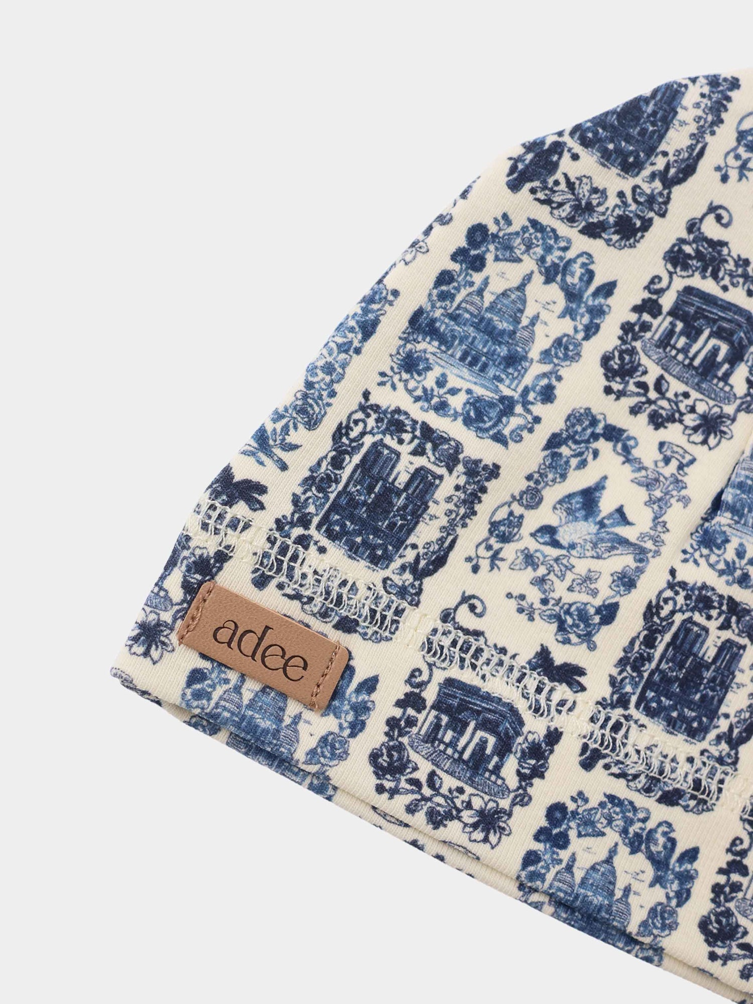 Blue Landmark Hat for boys by Adee, cream fabric with blue toile landmark print and leather label