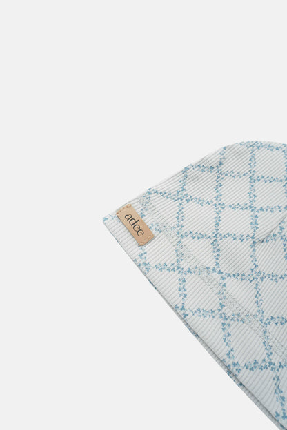 Blue leaf hat for boys by Adee; light gray plaid fabric with blue leaf pattern and brand tag.