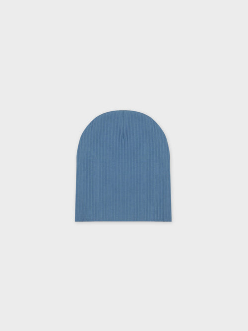 Blue thin-ribbed beanie for baby boys; soft, lightweight knit for cooler weather.