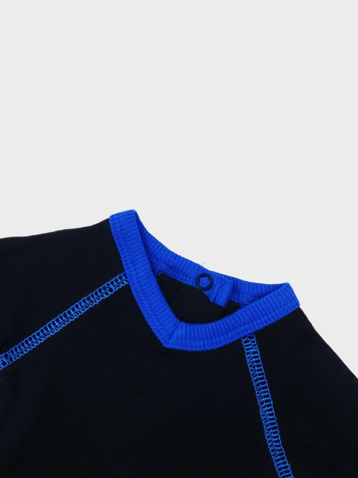Blue V-neck baby jumpsuit detail