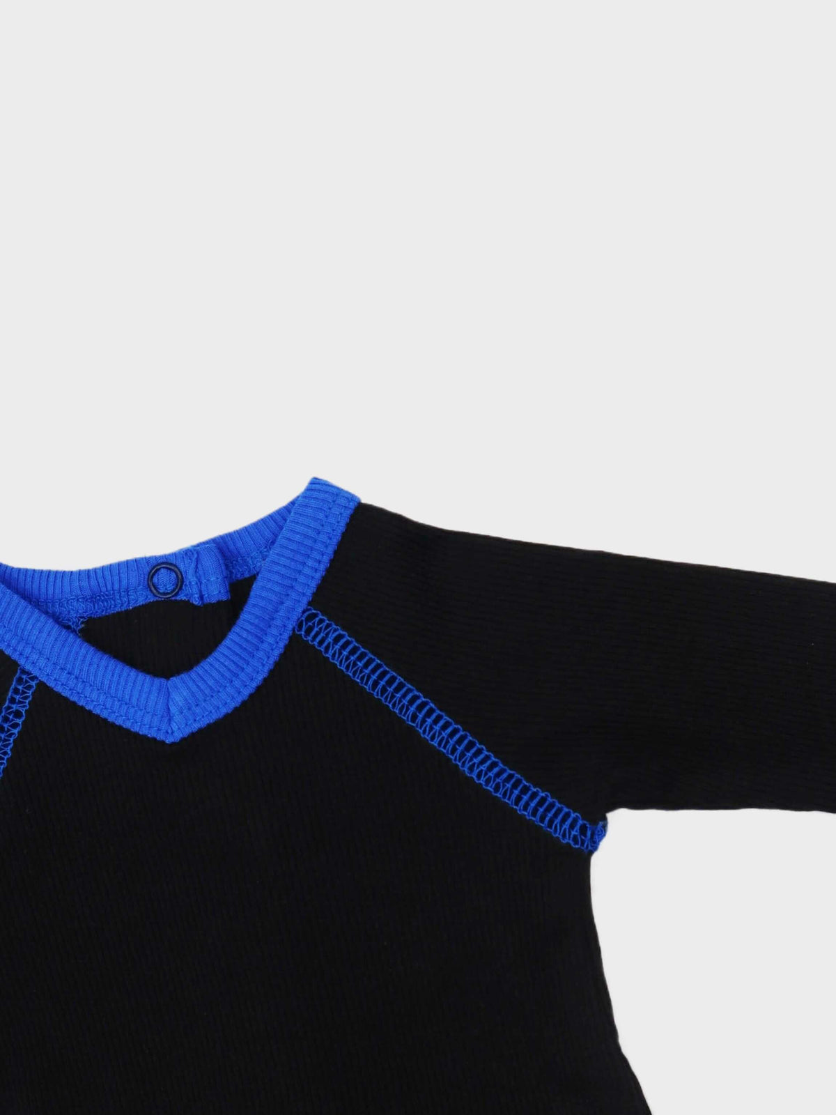 Baby jumpsuit with blue V-neck