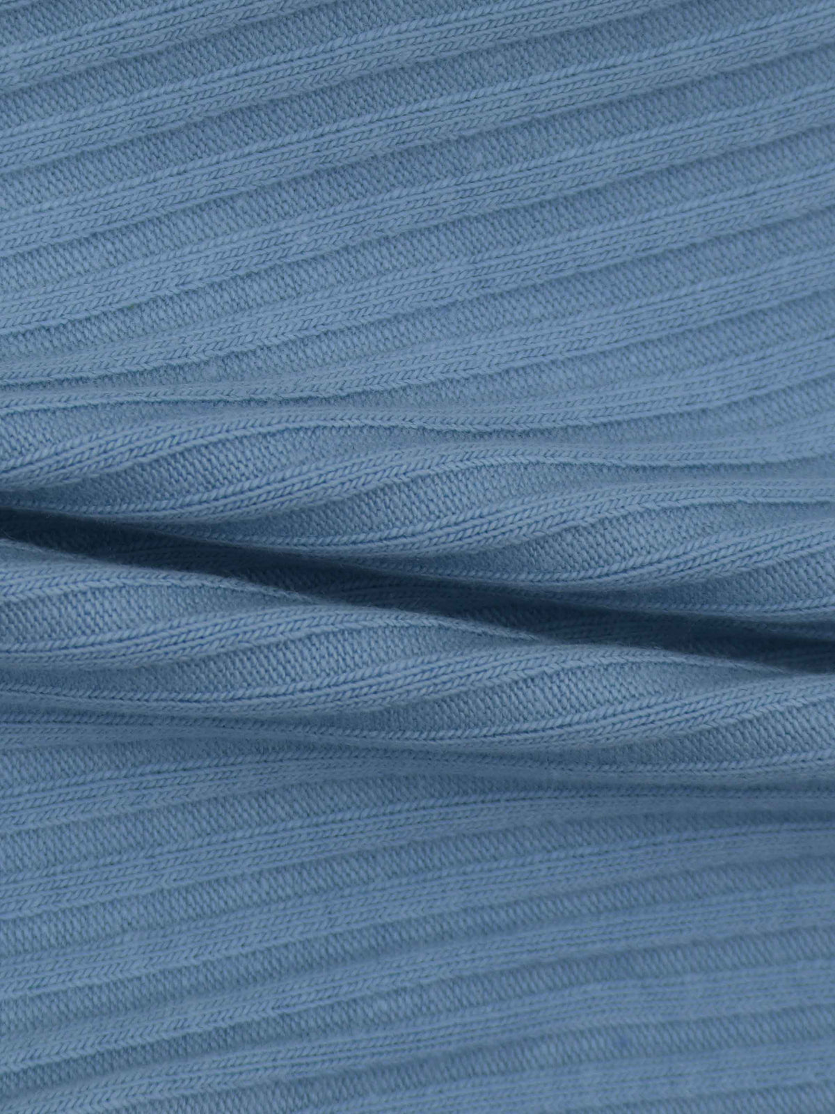 Close-up of blue thin-ribbed knit fabric for a baby beanie.