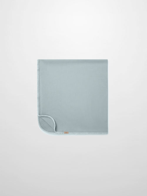 Legacy Stitch Blanket by Adee, light blue boys swaddle blanket with white fringe trim