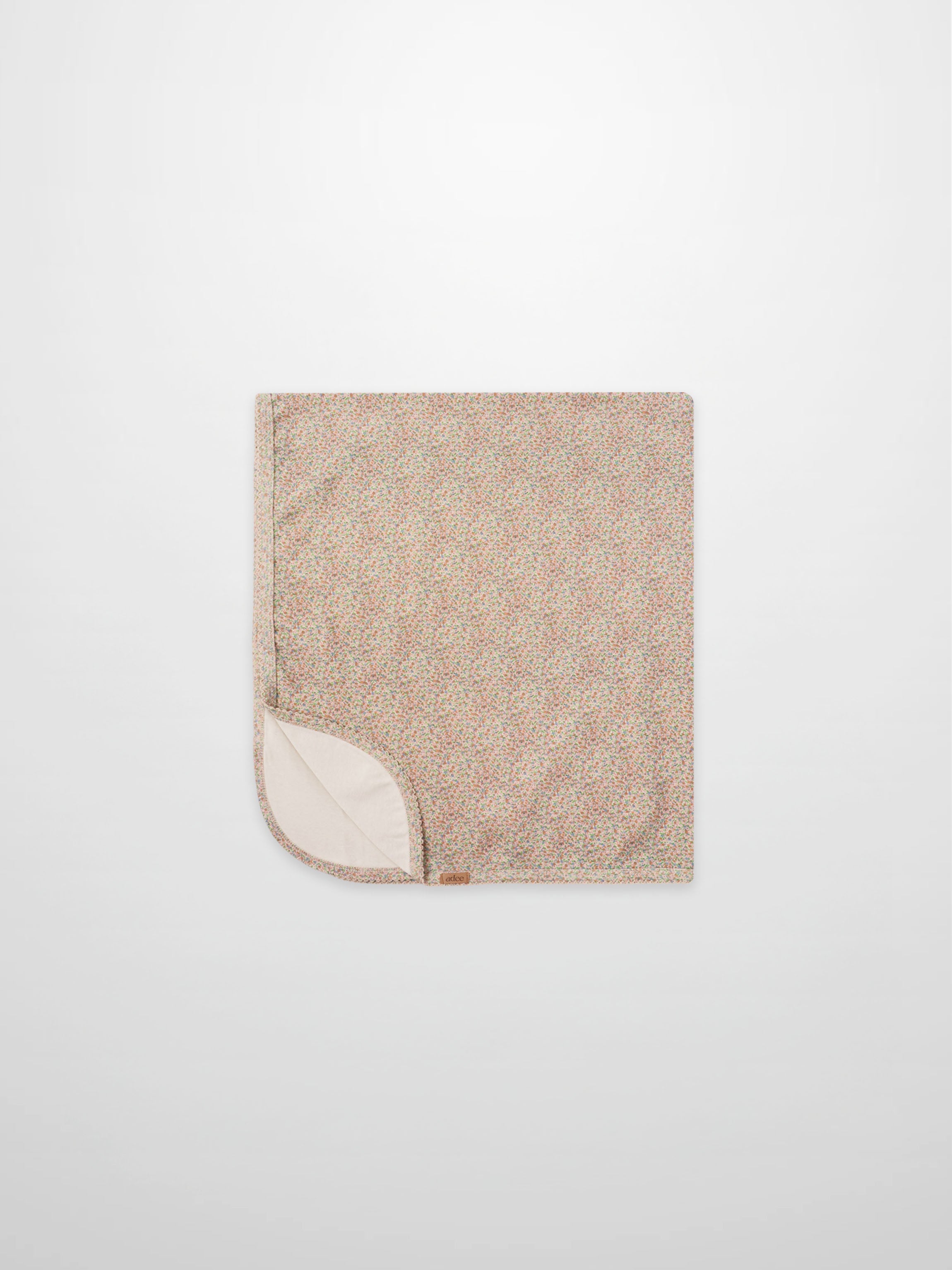 Pastel Petal Blanket swaddle for girls by Adee; pastel floral speckled pattern with cream underside