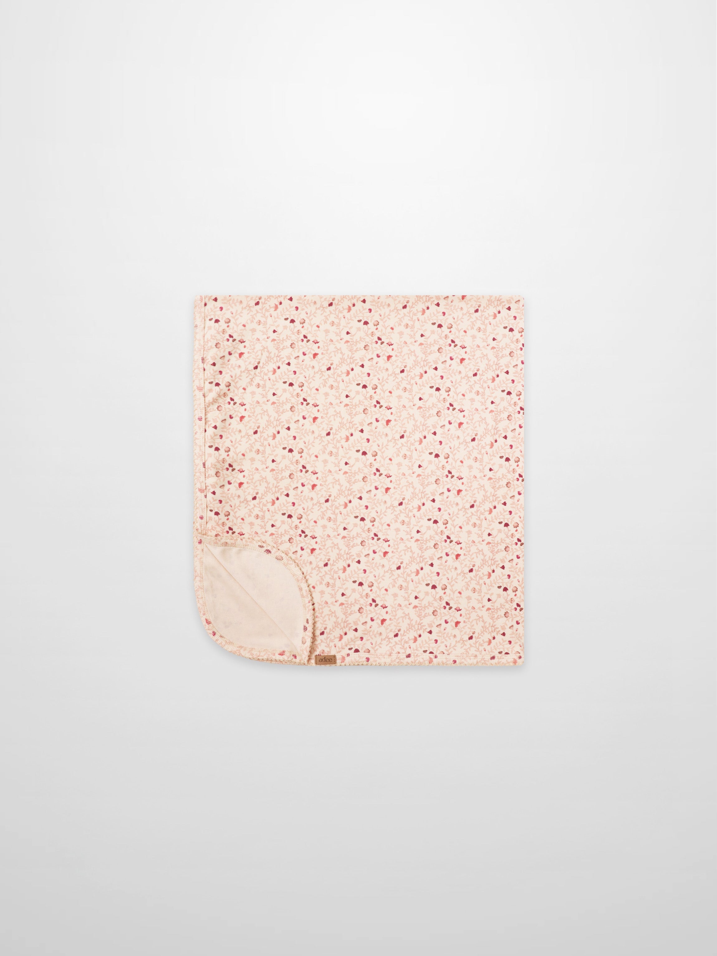 Garden Sprinkles Blanket by Adee; pink floral girls swaddle blanket with beige underside.