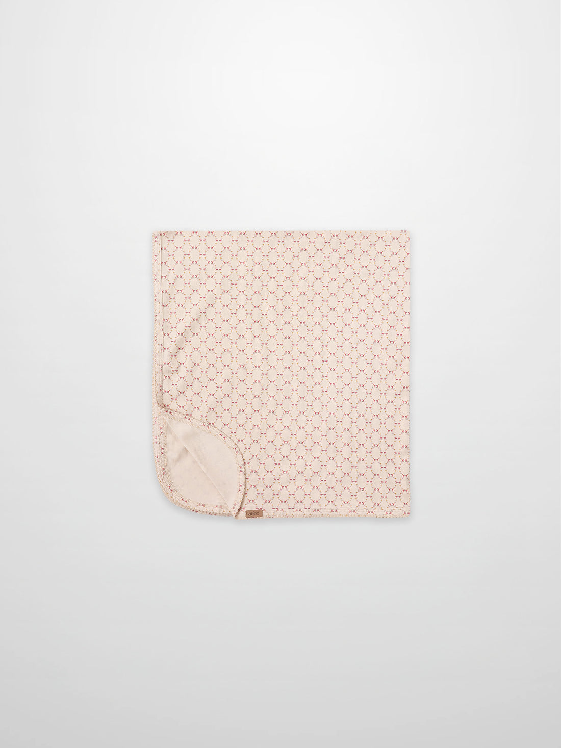 Floral Garland Blanket by Adee for girls swaddle; pink with tiny red floral pattern and soft backing.