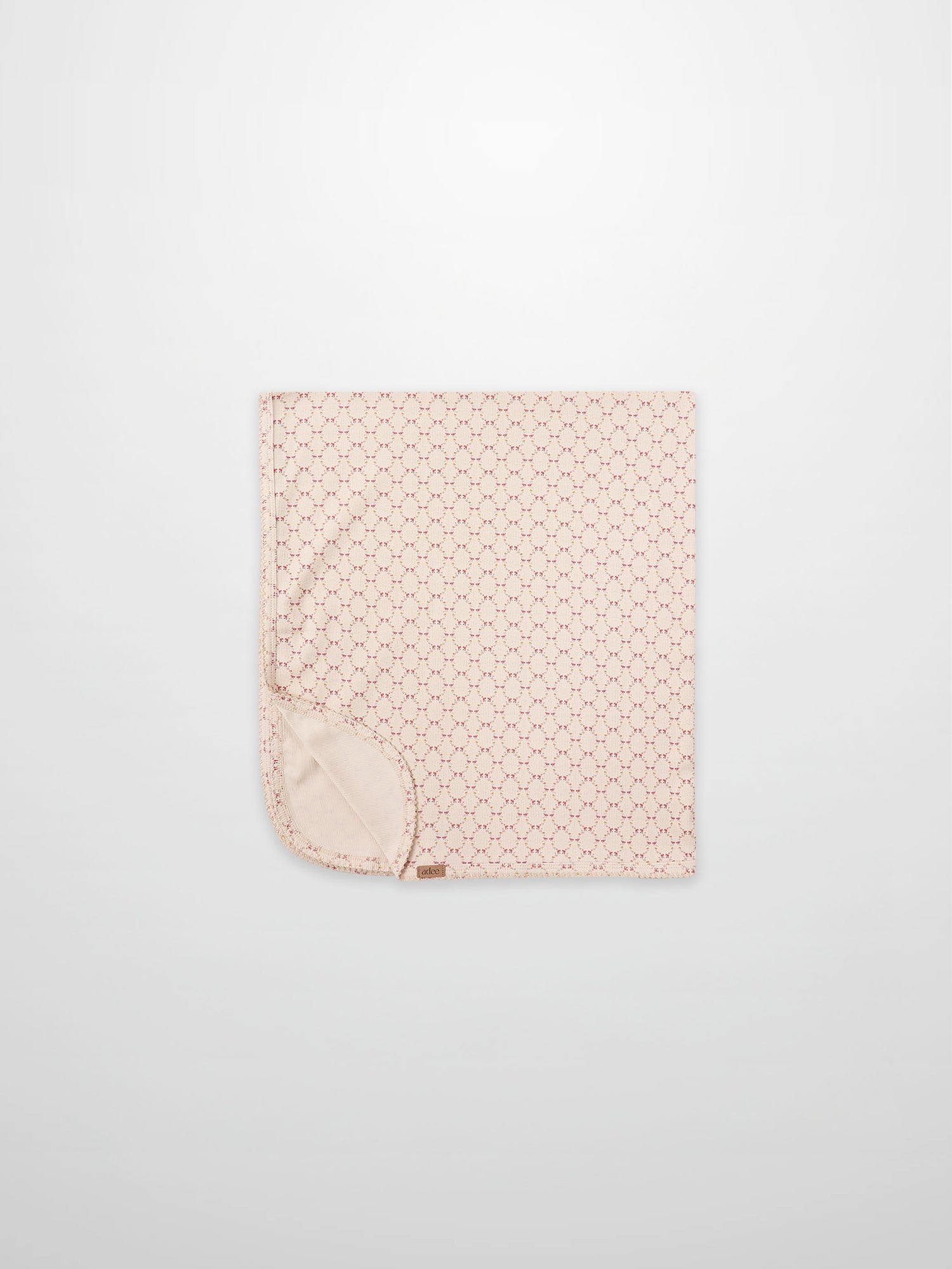Floral Garland Blanket by Adee for girls swaddle; pink with tiny red floral pattern and soft backing.