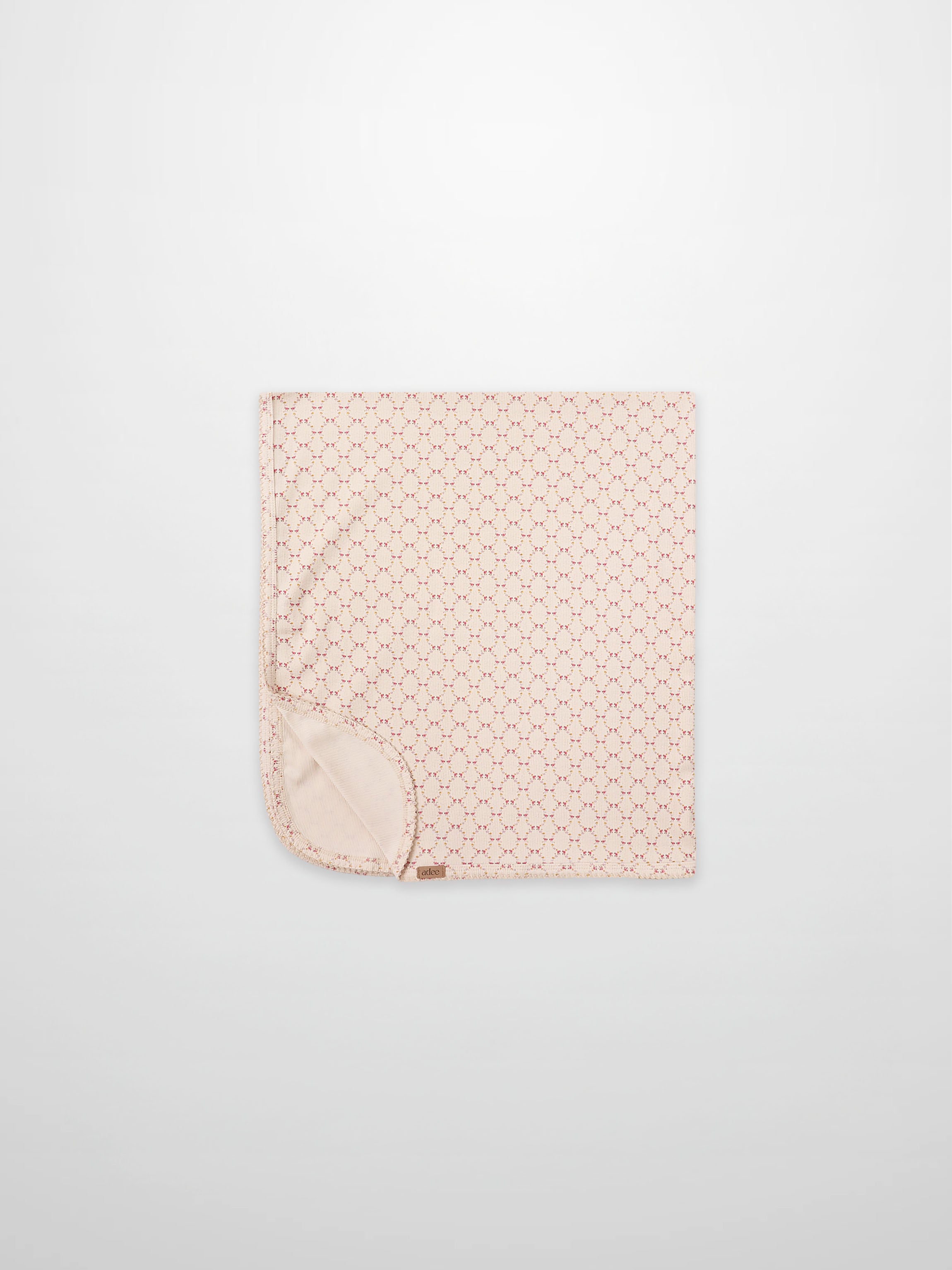 Floral Garland Blanket by Adee for girls swaddle; pink with tiny red floral pattern and soft backing.