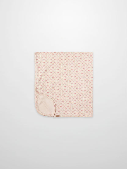 Floral Garland Blanket by Adee for girls swaddle; pink with tiny red floral pattern and soft backing.