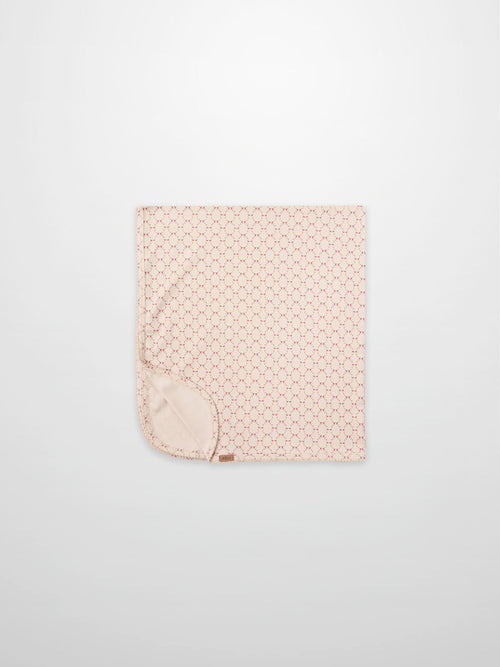 Floral Garland Blanket by Adee for girls swaddle; pink with tiny red floral pattern and soft backing.