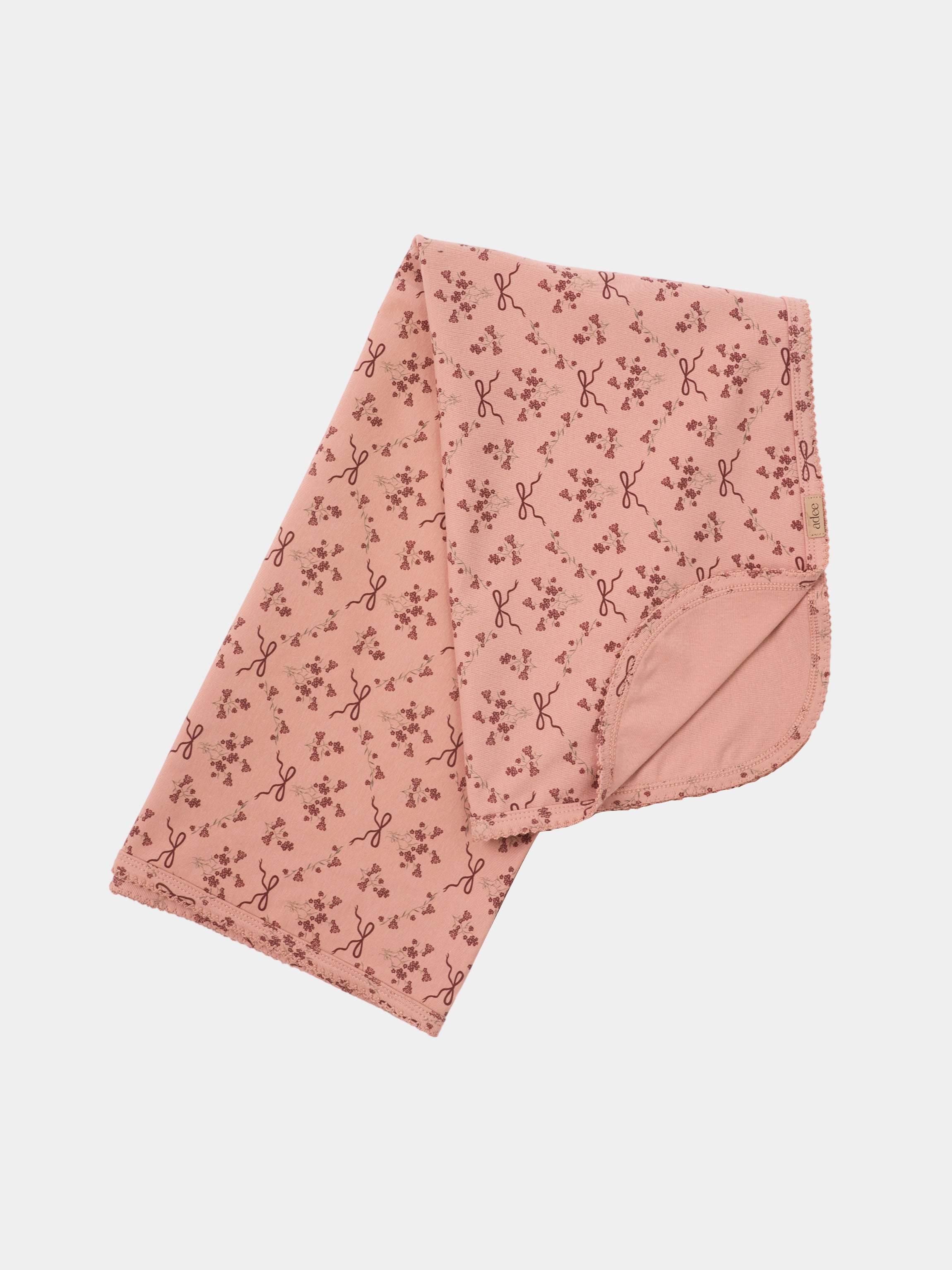 Bow Bouquet Blanket by Adee; pink swaddle blanket with tiny floral bows.