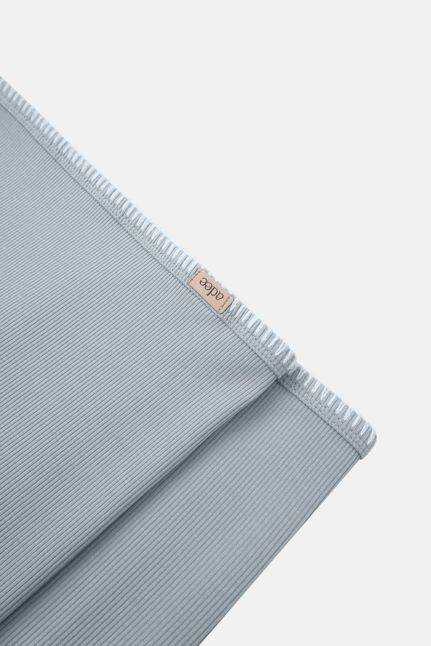 Legacy Stitch Blanket Light Blue swaddle by Adee for boys; ribbed fabric with beige brand tag