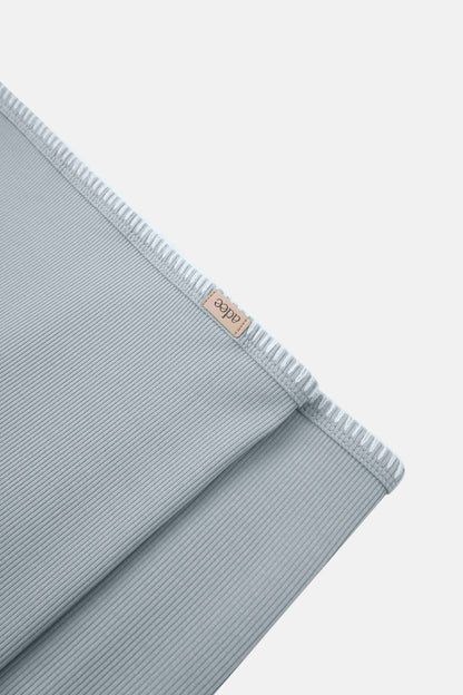 Legacy Stitch Blanket Light Blue swaddle by Adee for boys; ribbed fabric with beige brand tag