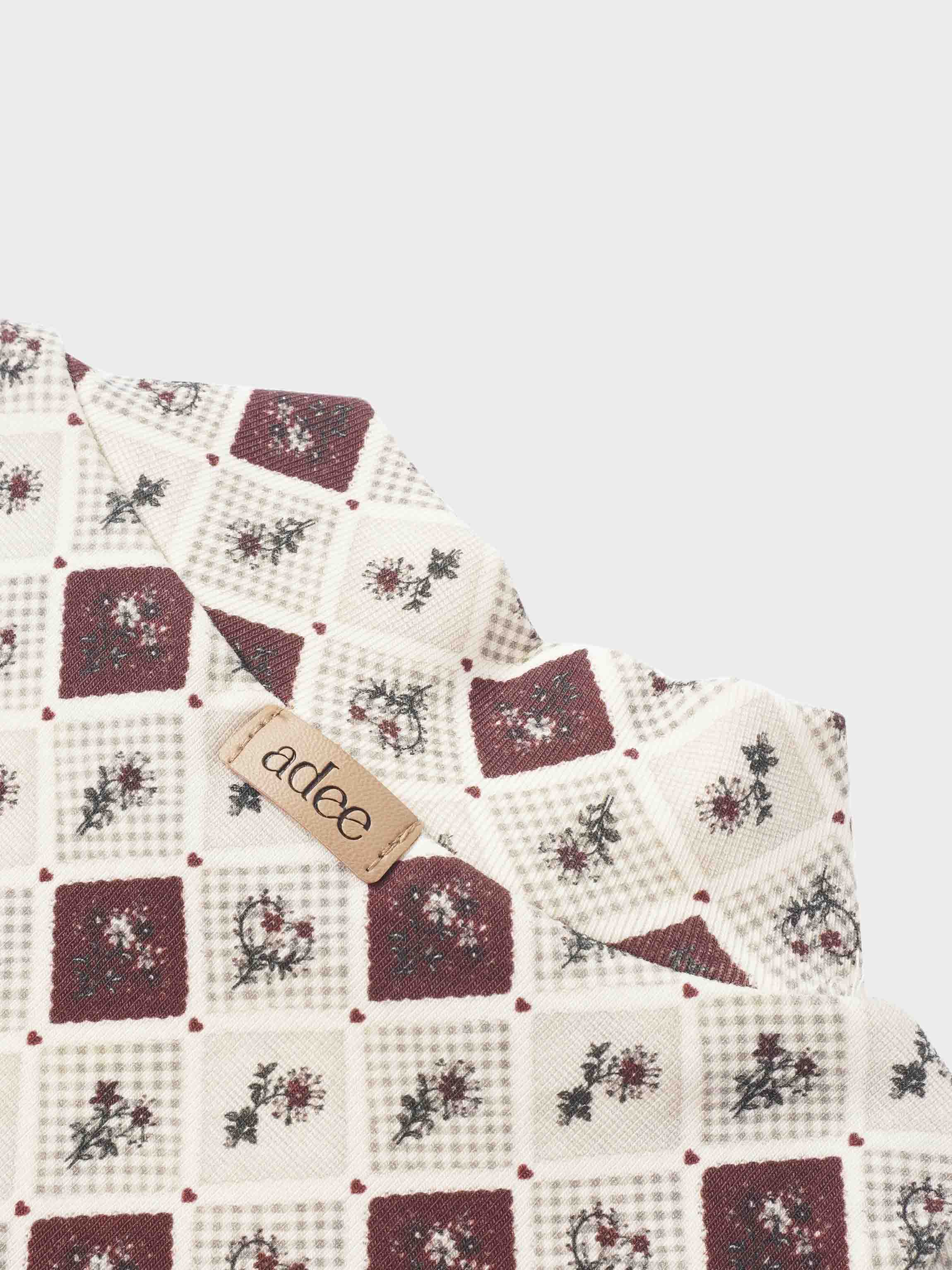 Adee mosaic floral mock neck girls top; cream and burgundy mosaic squares with small floral motifs, brand tag visible.