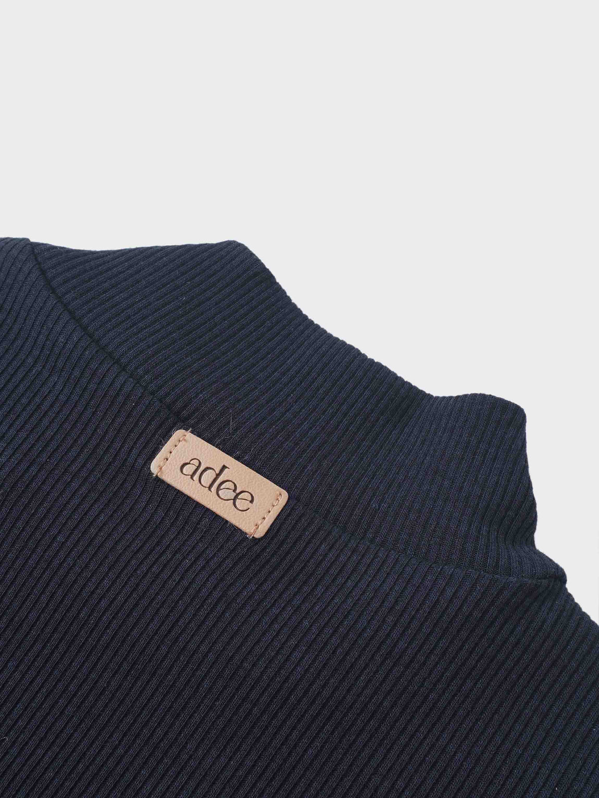 Ribbed mock-neck navy bodysuit by Adee; unisex dressy top with visible tag