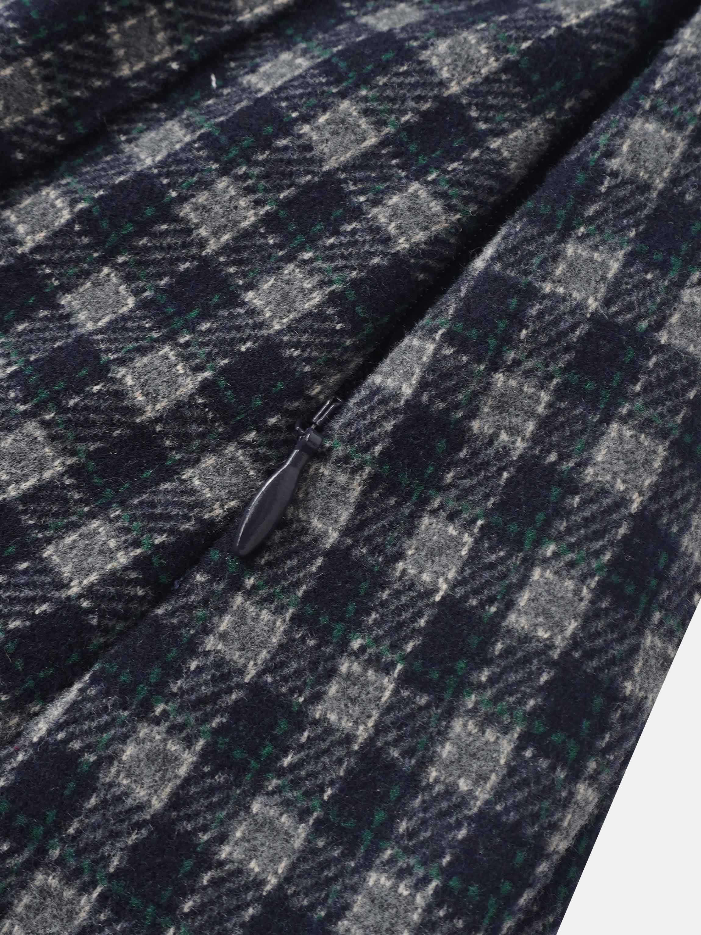Plaid pleated skirt navy by Adee; close-up of textured fabric with grey and green checks and visible zipper