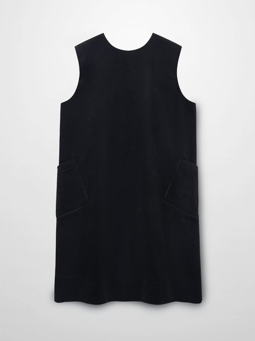 Black corduroy jumper with round neckline, A-line silhouette, and front patch pockets.