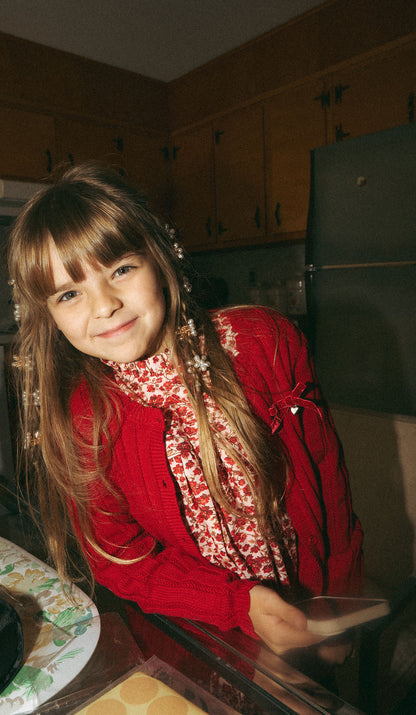 Knit Cardigan - Red worn by smiling girl; dressy girls top in red knit over a floral blouse
