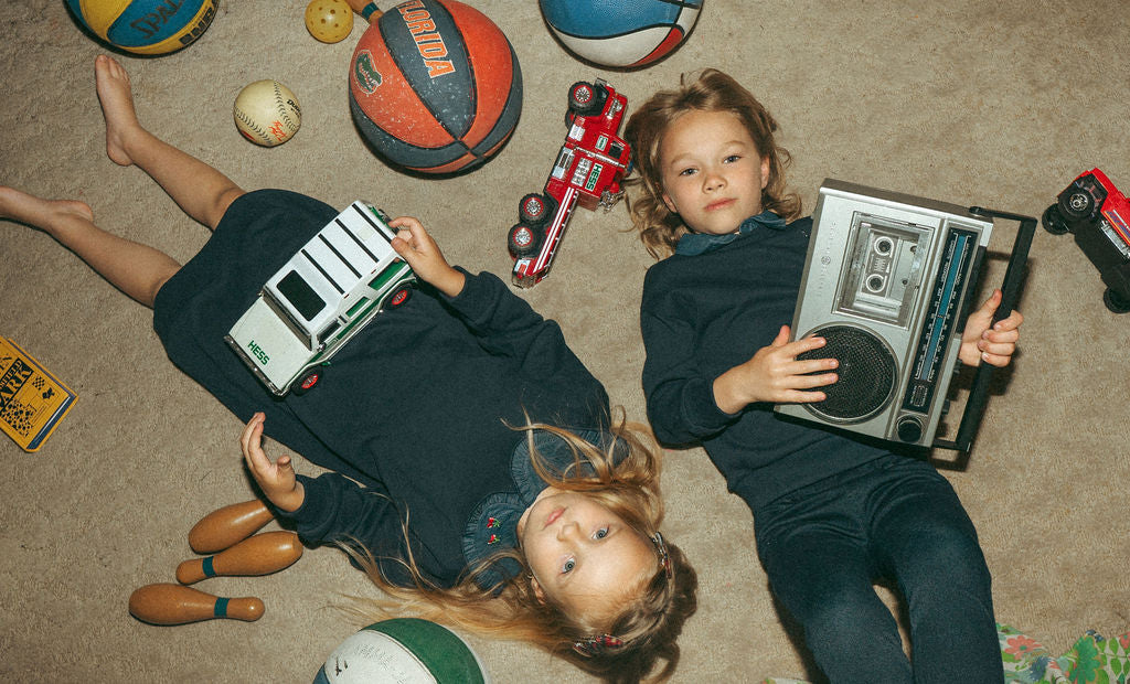 Denim Cherry Collar Dress by Adee; navy girls dress, shown on 3 kids with toys