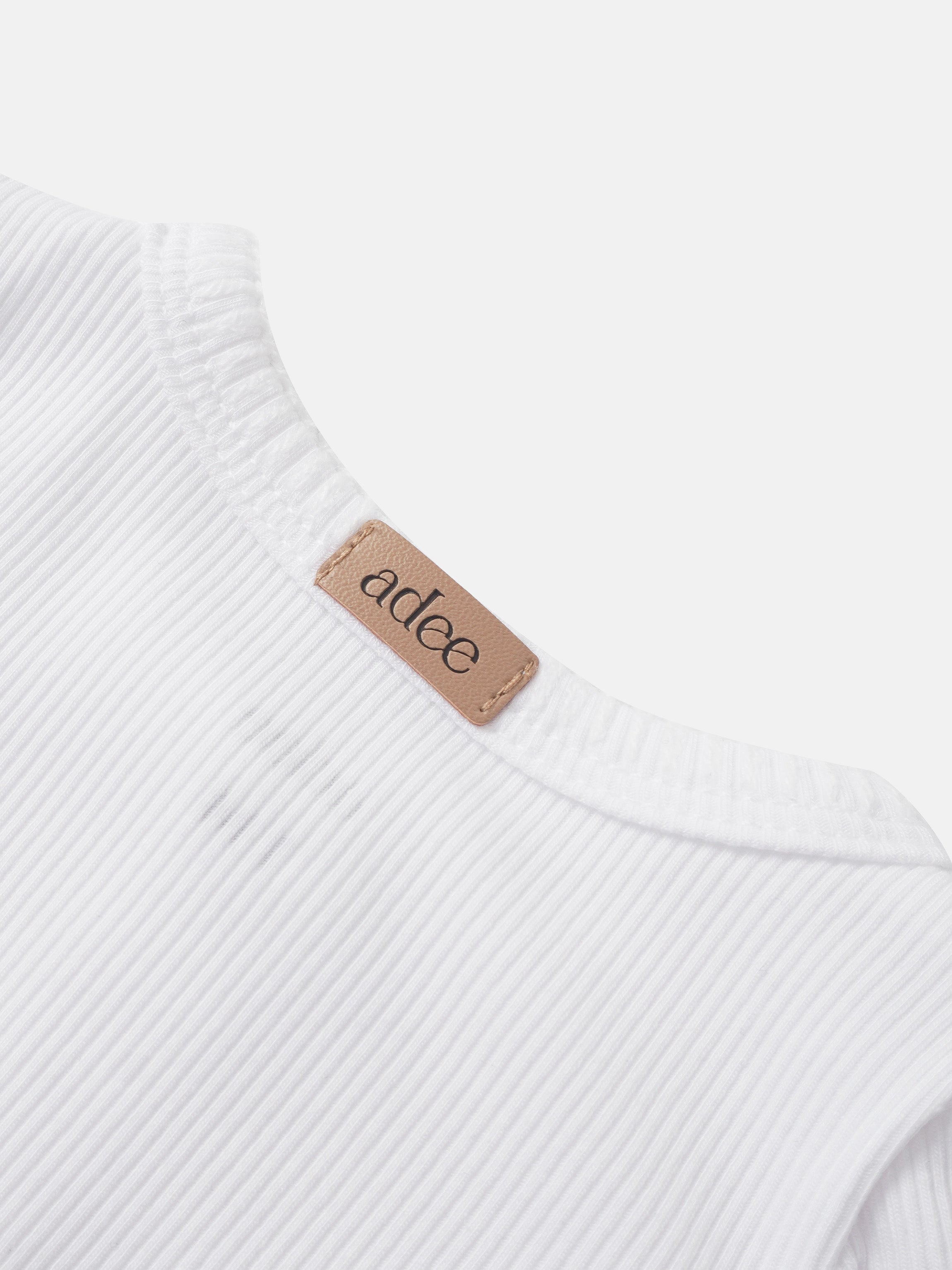 Legacy Stitch Cardigan - White, rib-knit fabric with tan Adee label.