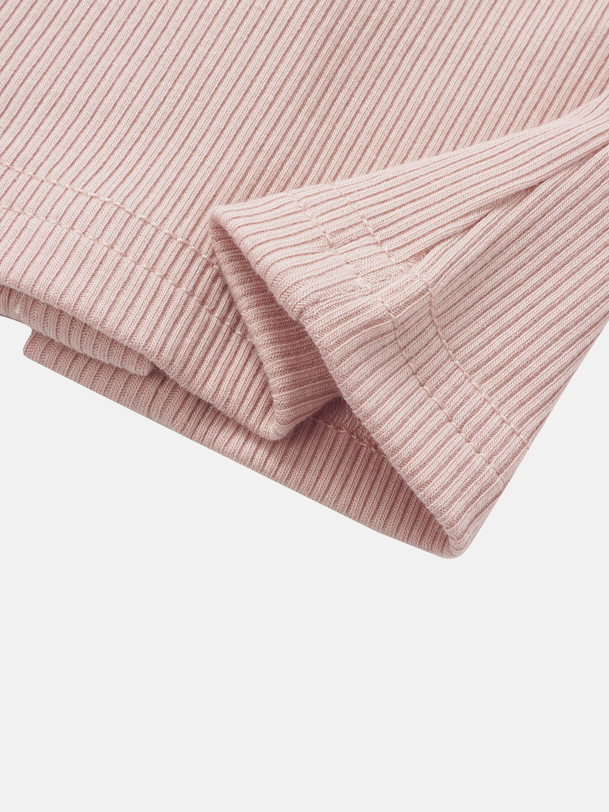 Legacy Stitch Cardigan in light pink ribbed knit, close-up of sleeve cuff.