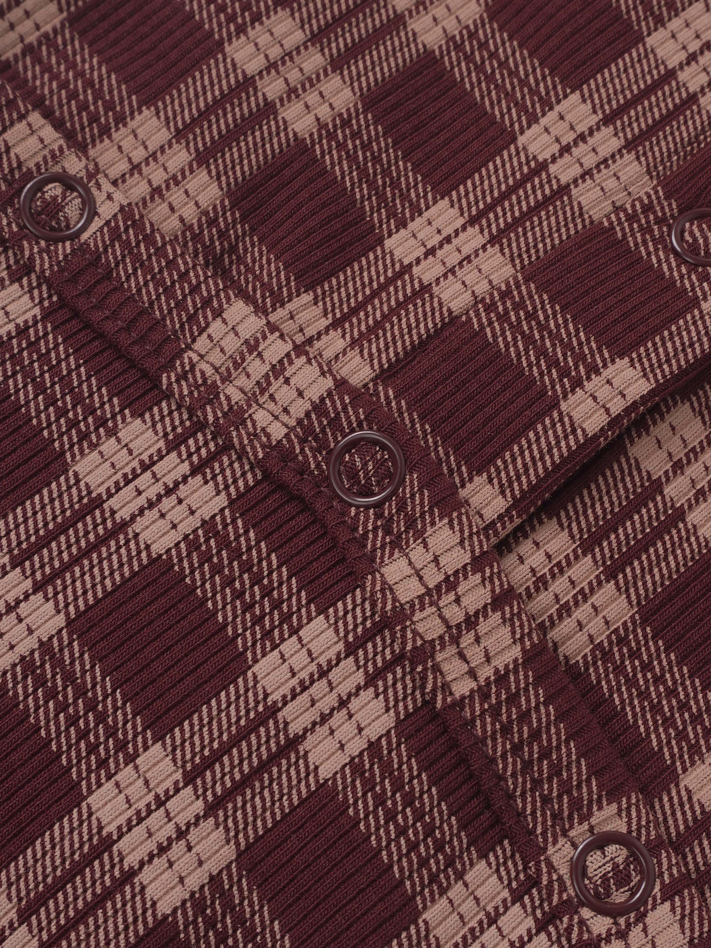 Adee burgundy plaid girls layette set fabric close-up with round eyelet closures