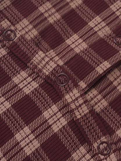 Adee burgundy plaid girls layette set fabric close-up with round eyelet closures