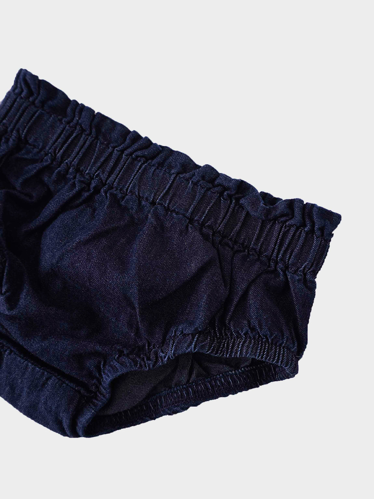 Dark denim baby bloomers close-up