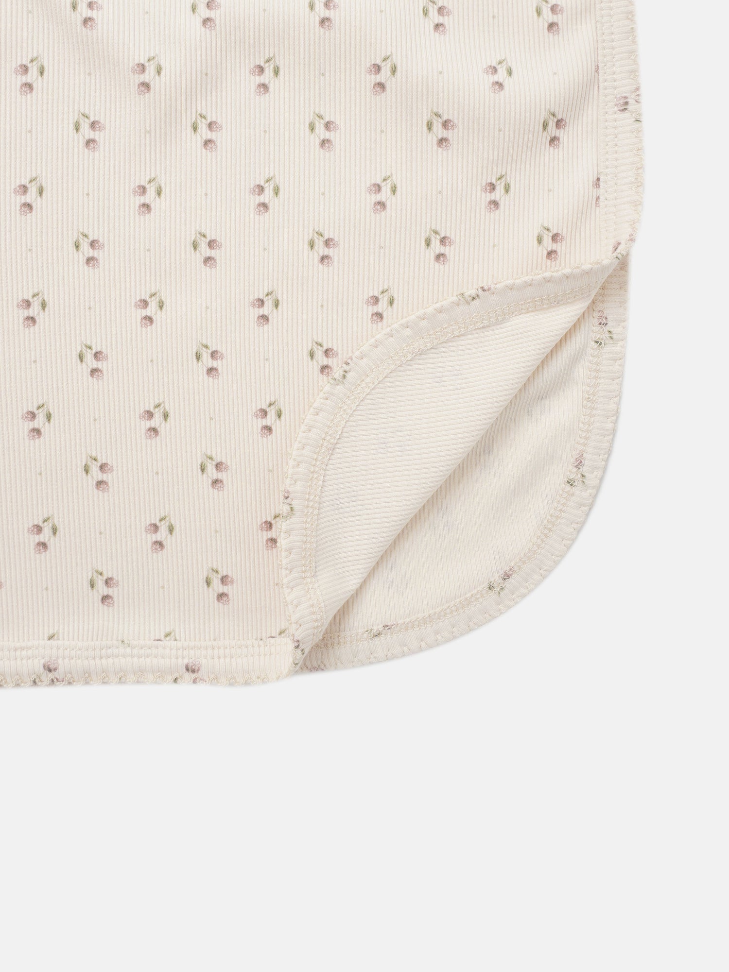 Tiny Tulip Blanket swaddle for girls with pale pink cherry print and ribbed edge